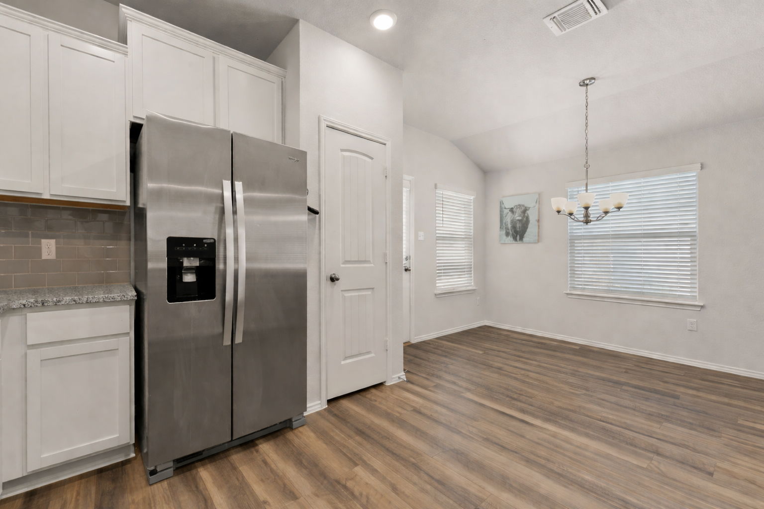 108 Pivot Drive Taylor, TX 76574 - Photo 11 of 30 a view of a kitchen with a refrigerator and window