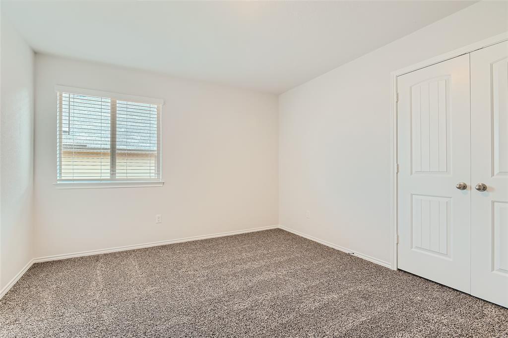 108 Pivot Drive Taylor, TX 76574 - Photo 19 of 30 an empty room with windows