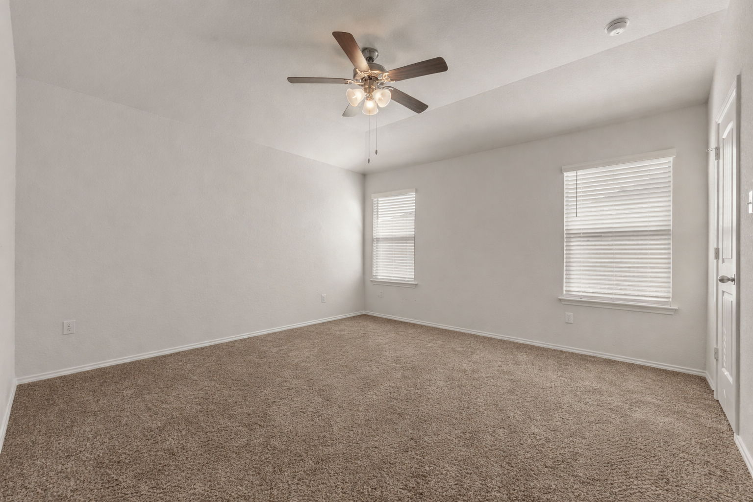 108 Pivot Drive Taylor, TX 76574 - Photo 21 of 30 an empty room with a window and a ceiling fan
