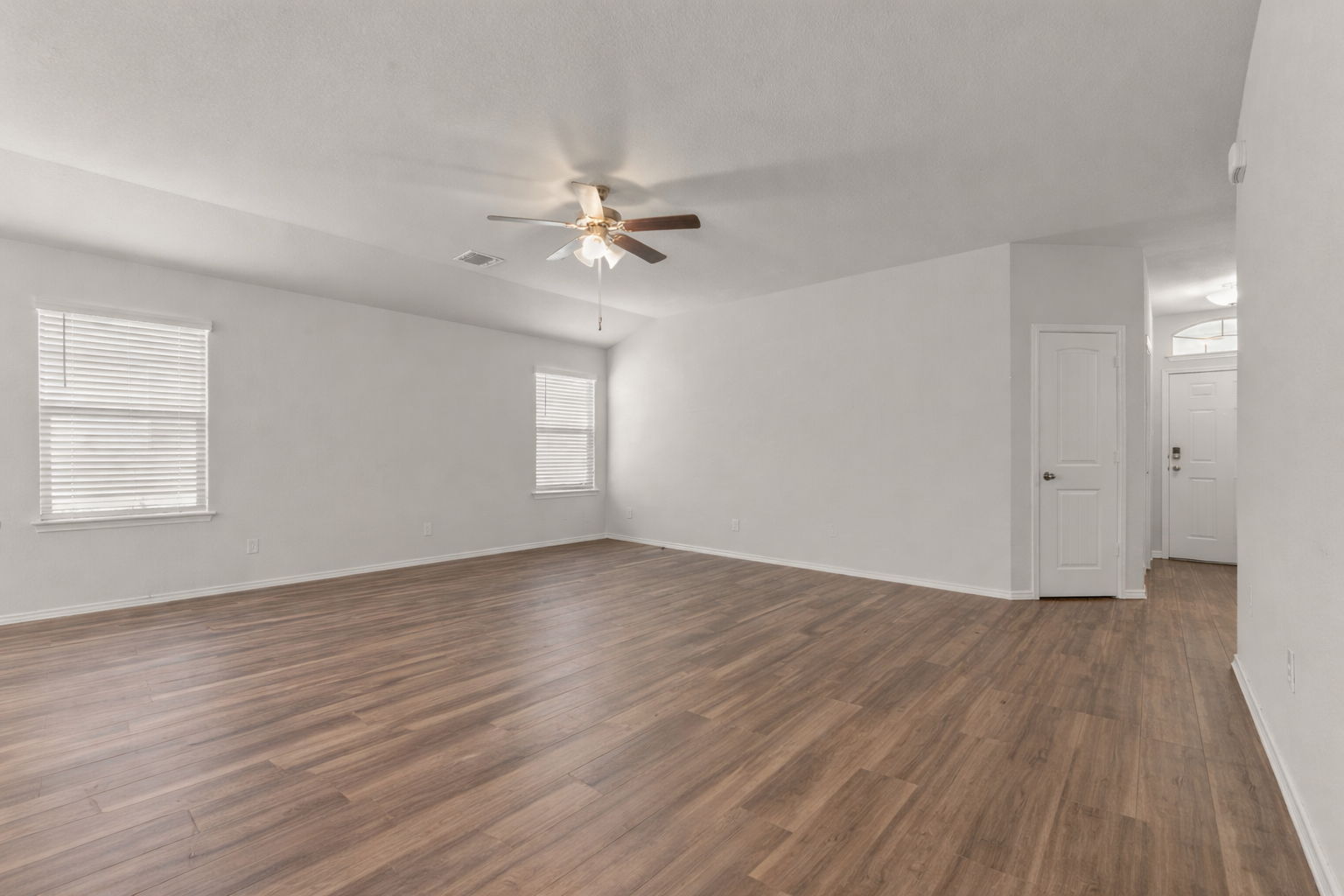 108 Pivot Drive Taylor, TX 76574 - Photo 3 of 30 a view of empty room with wooden floor and fan