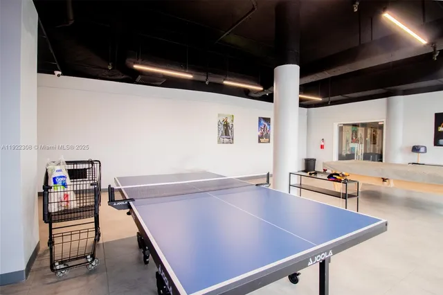 a room with furniture pool table and furniture