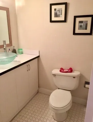 a bathroom with a toilet and a sink