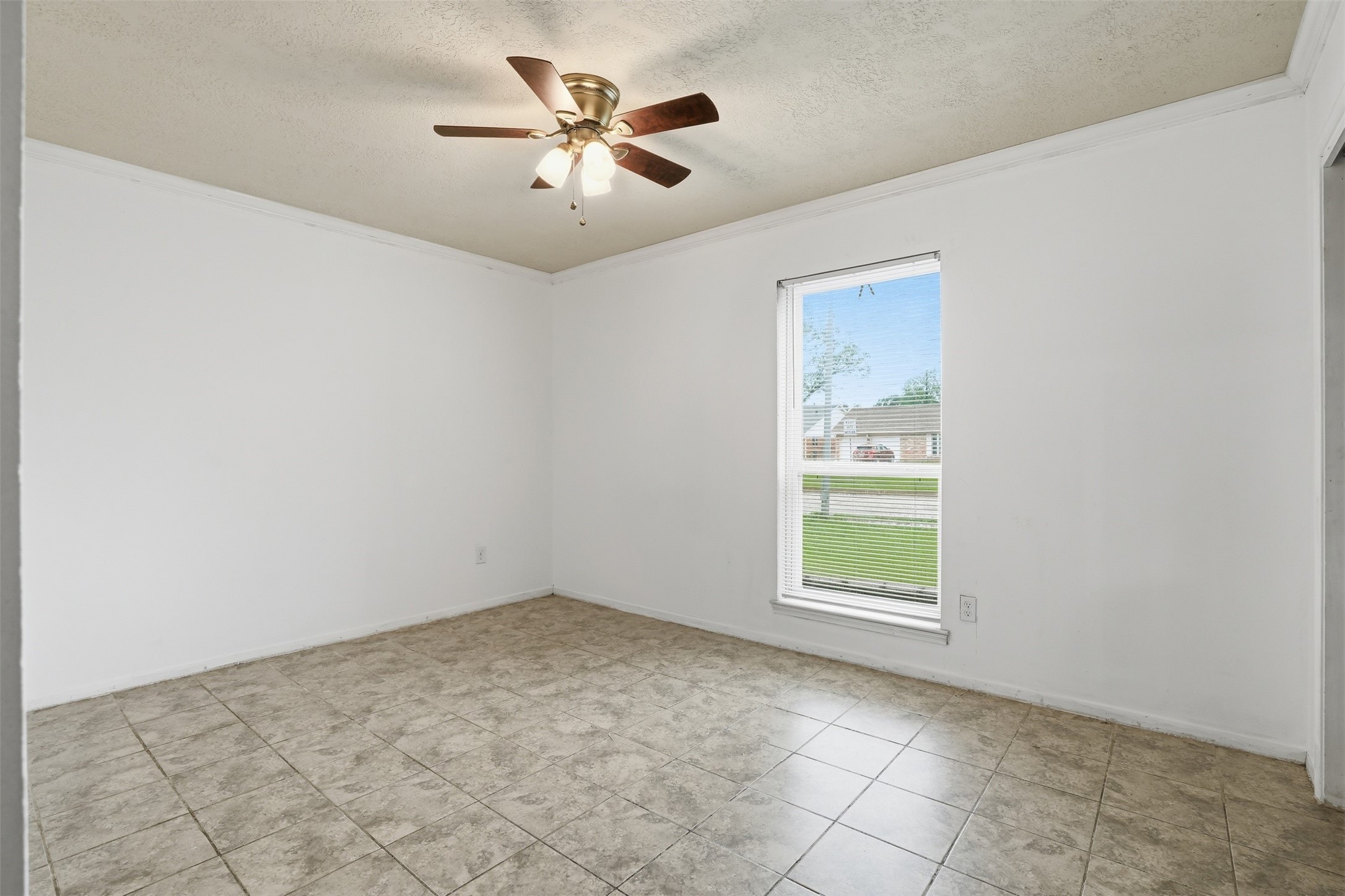 2605 Burke Road Pasadena, TX 77502 - Photo 21 of 29 an empty room with windows and fan