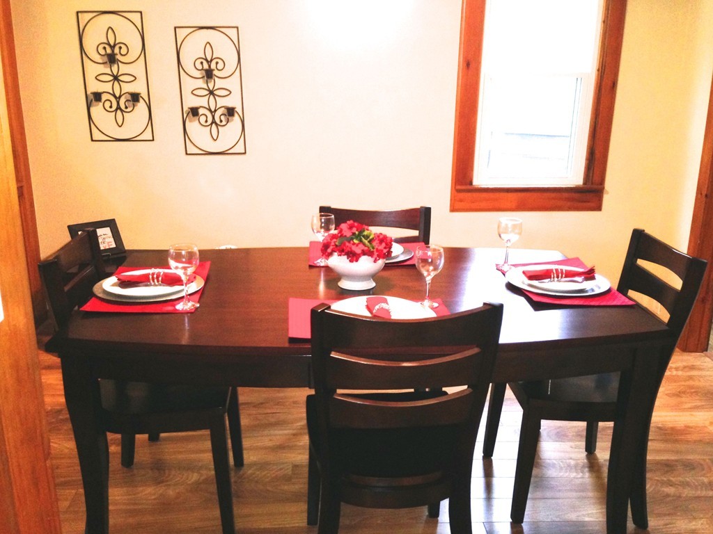 89 Judson Street Springfield, MA 01104 - Photo 5 of 12 a view of a dining room with furniture and wooden floor