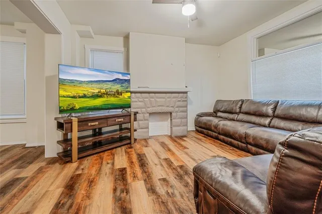 a bedroom with a bed and a large window with outer view