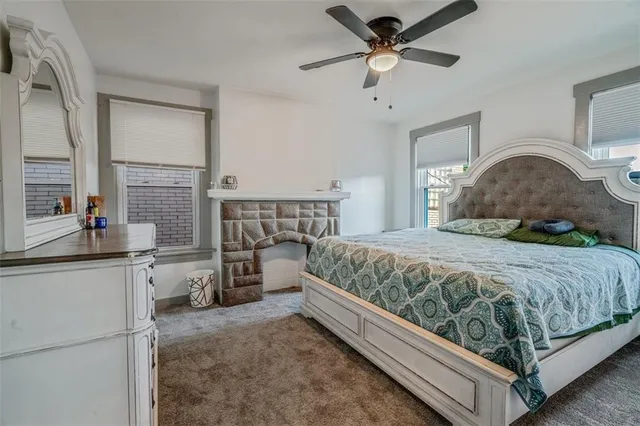 a bedroom with a bed and a mirror