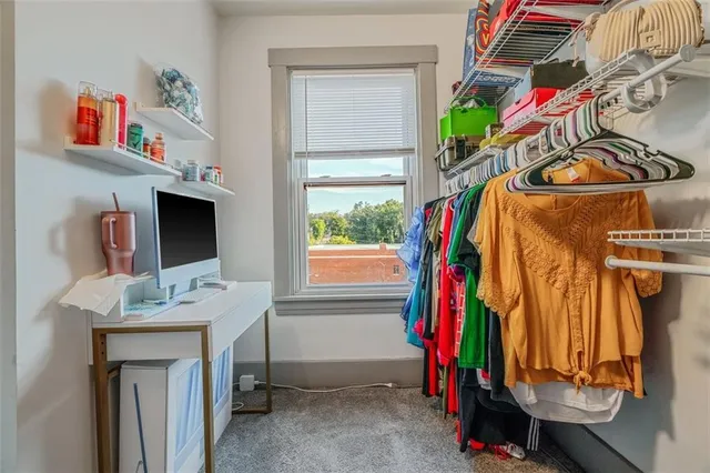 a bedroom with a bed and dresser