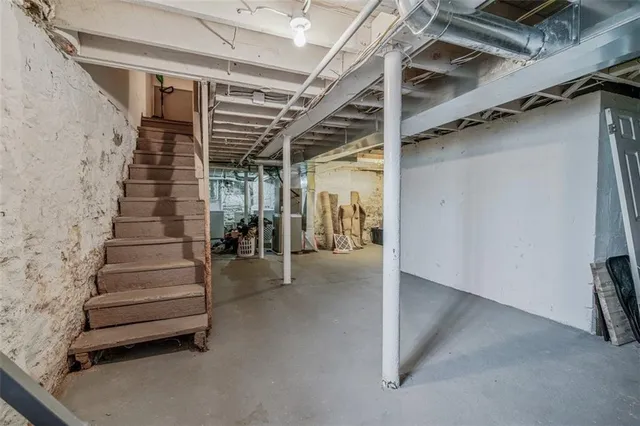 a balcony with furniture and wooden floor
