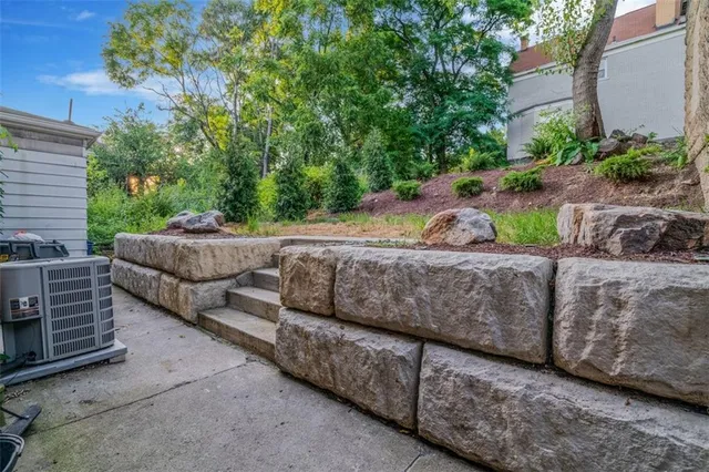 a view of a house with a yard and plants