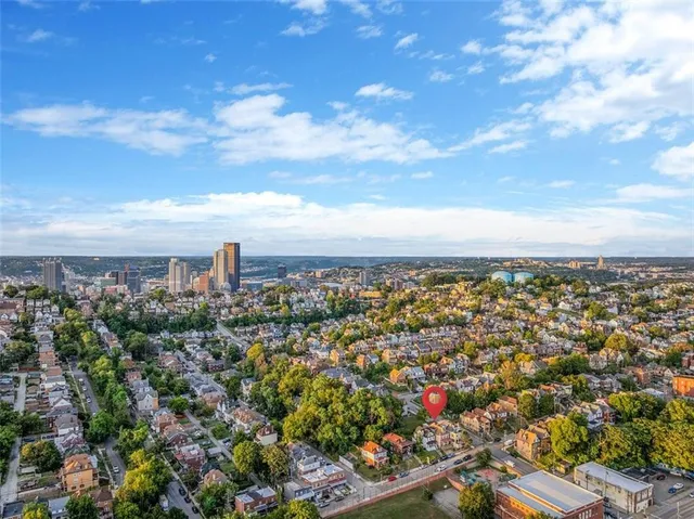 a view of a city with lots of green space