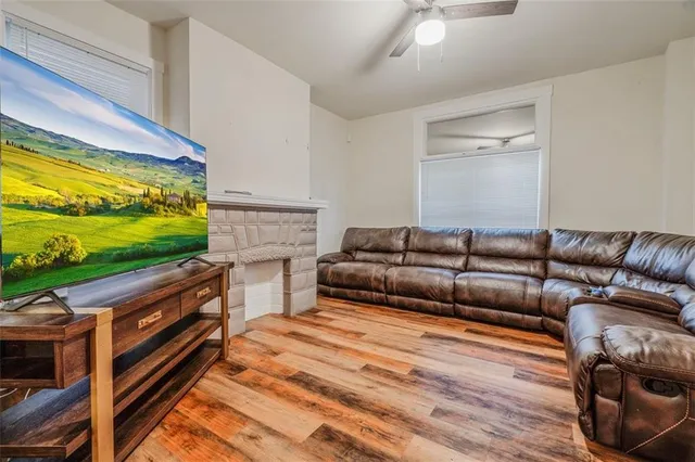 a bedroom with a bed and a television