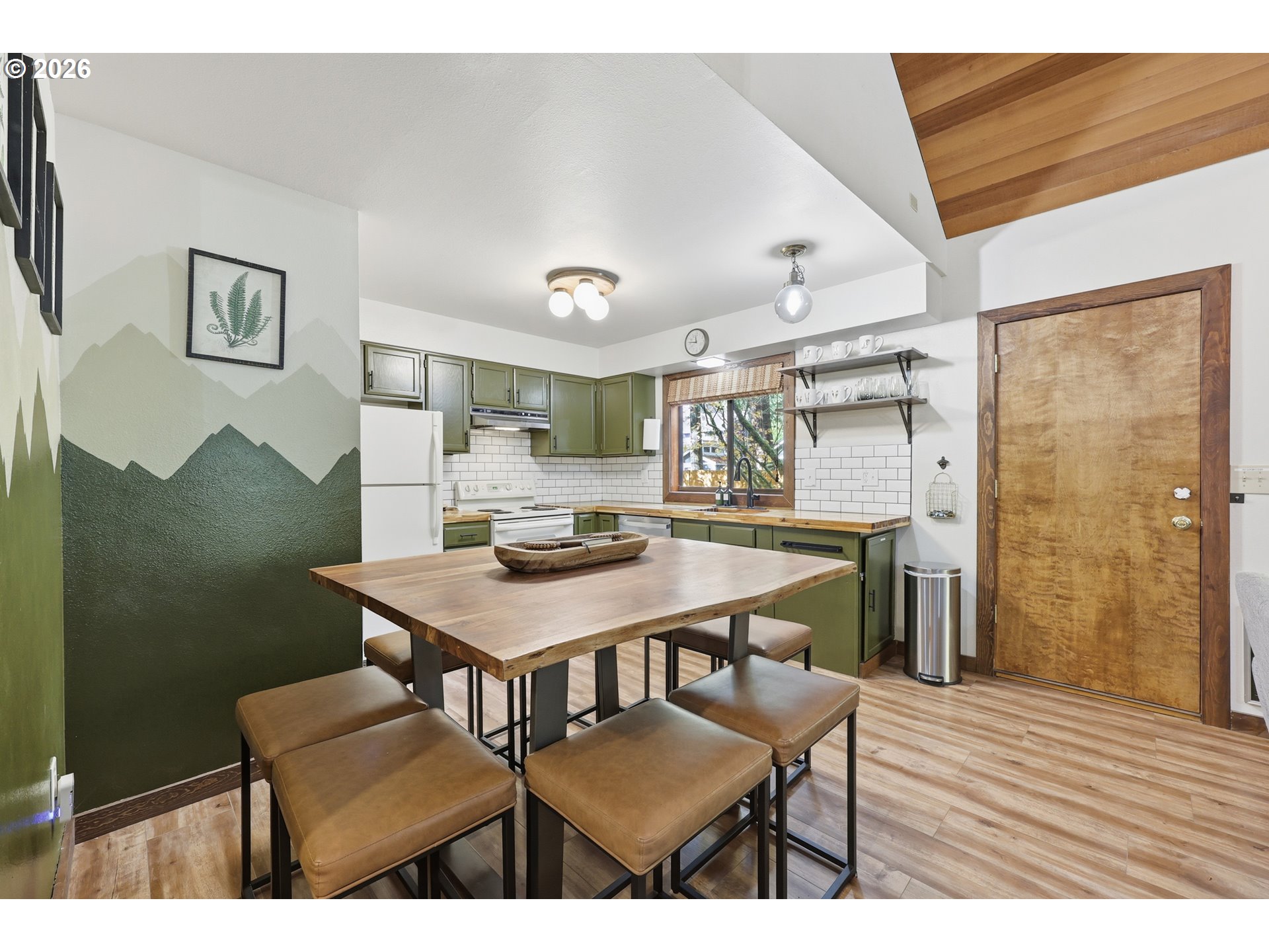 65582 East Timberline Drive Rhododendron, OR 97049 - Photo 7 of 47 a view of a room that has a table and chairs