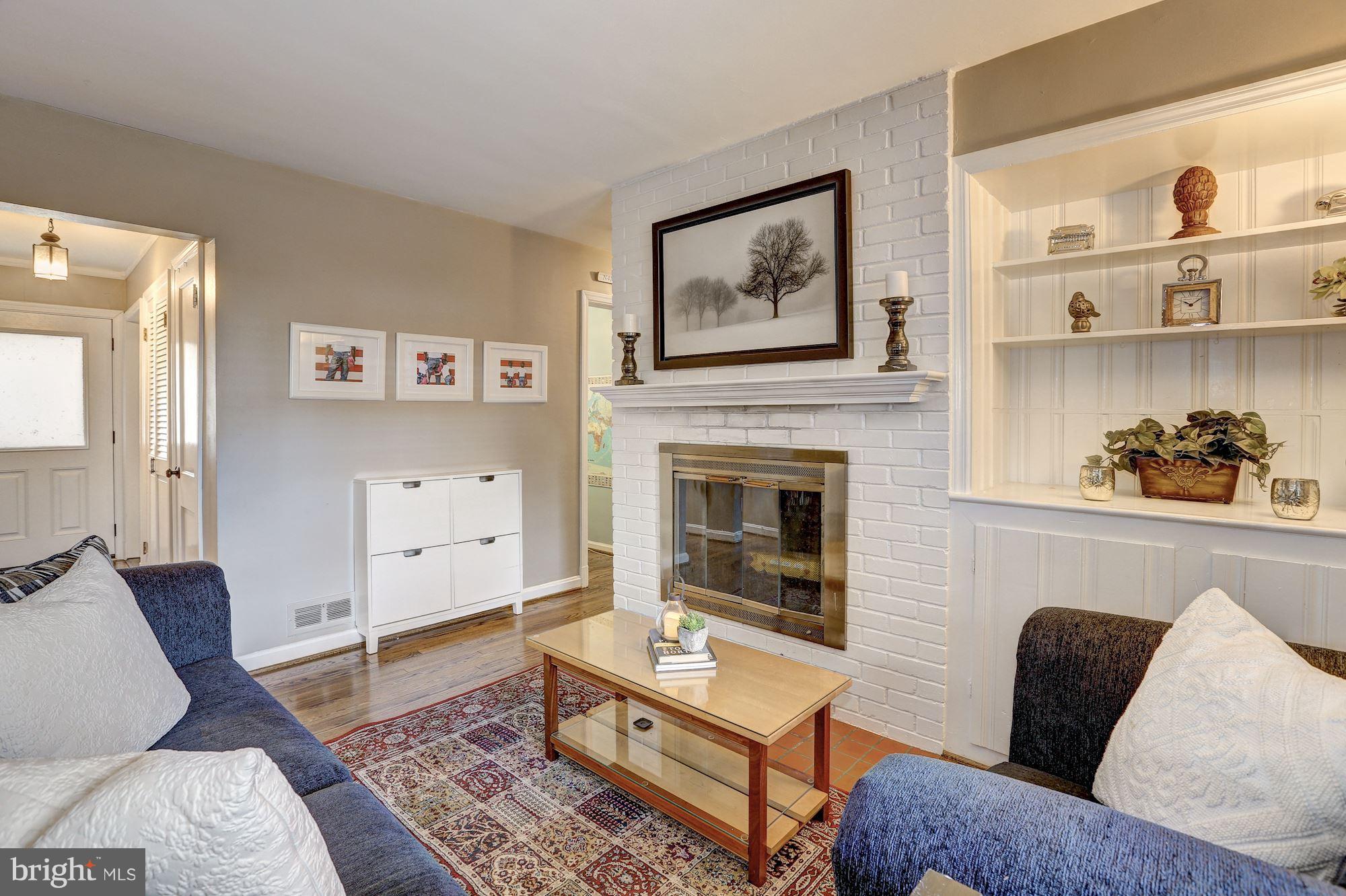 10205 Procter Street Silver Spring, MD 20901 - Photo 13 of 38 a living room with furniture and a fireplace