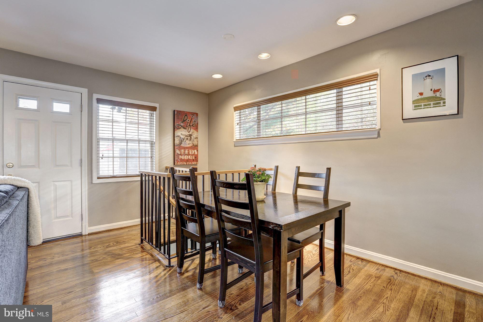 10205 Procter Street Silver Spring, MD 20901 - Photo 15 of 38 a view of a dining room with furniture window and wooden floor