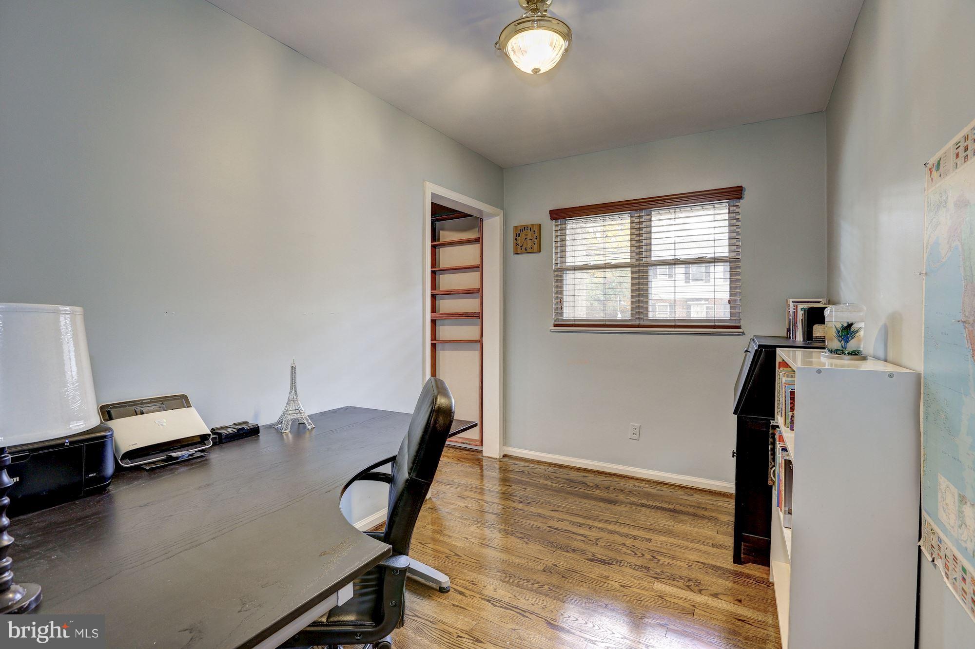 10205 Procter Street Silver Spring, MD 20901 - Photo 23 of 38 a view of a workspace with furniture and a window