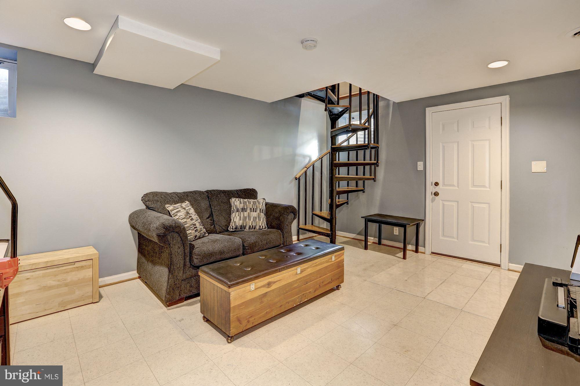 10205 Procter Street Silver Spring, MD 20901 - Photo 25 of 38 a living room with furniture and a wooden floor