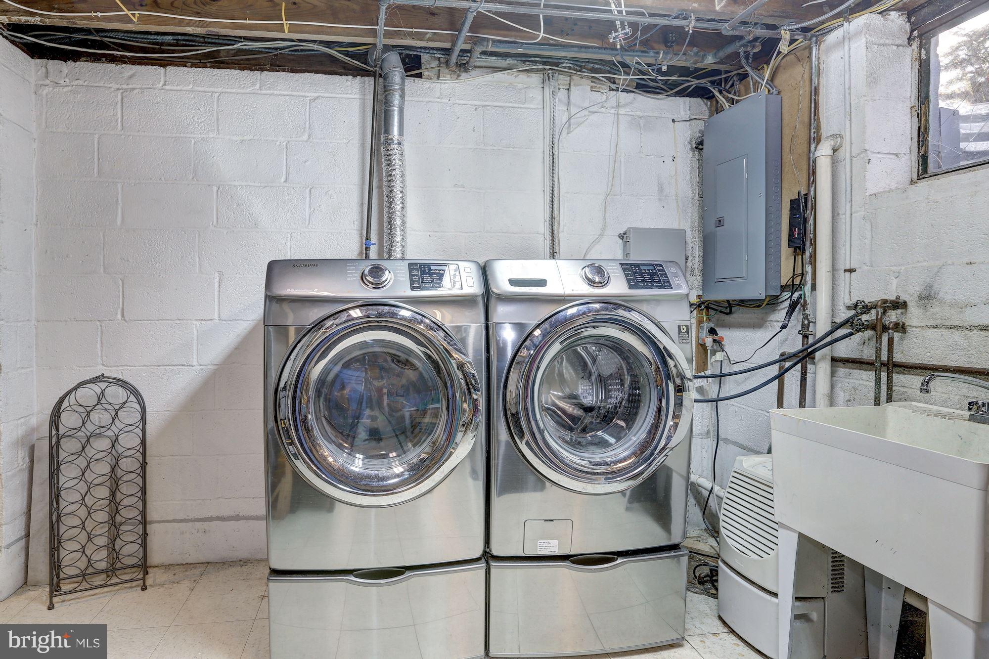 10205 Procter Street Silver Spring, MD 20901 - Photo 28 of 38 a utility room with sink dryer and washer