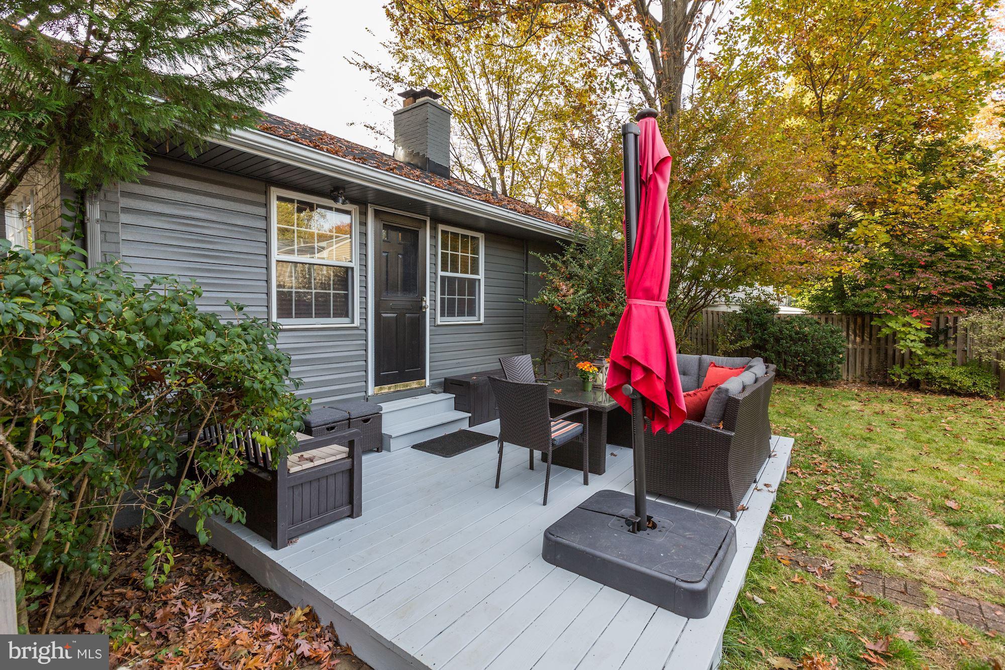 10205 Procter Street Silver Spring, MD 20901 - Photo 31 of 38 a house view with a garden and outdoor seating