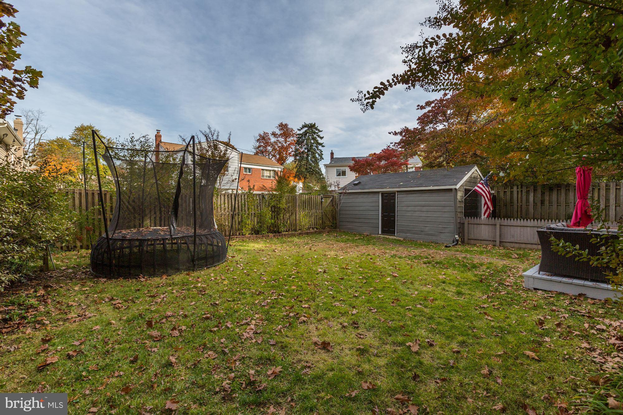 10205 Procter Street Silver Spring, MD 20901 - Photo 32 of 38 a view of a house with backyard and a tree