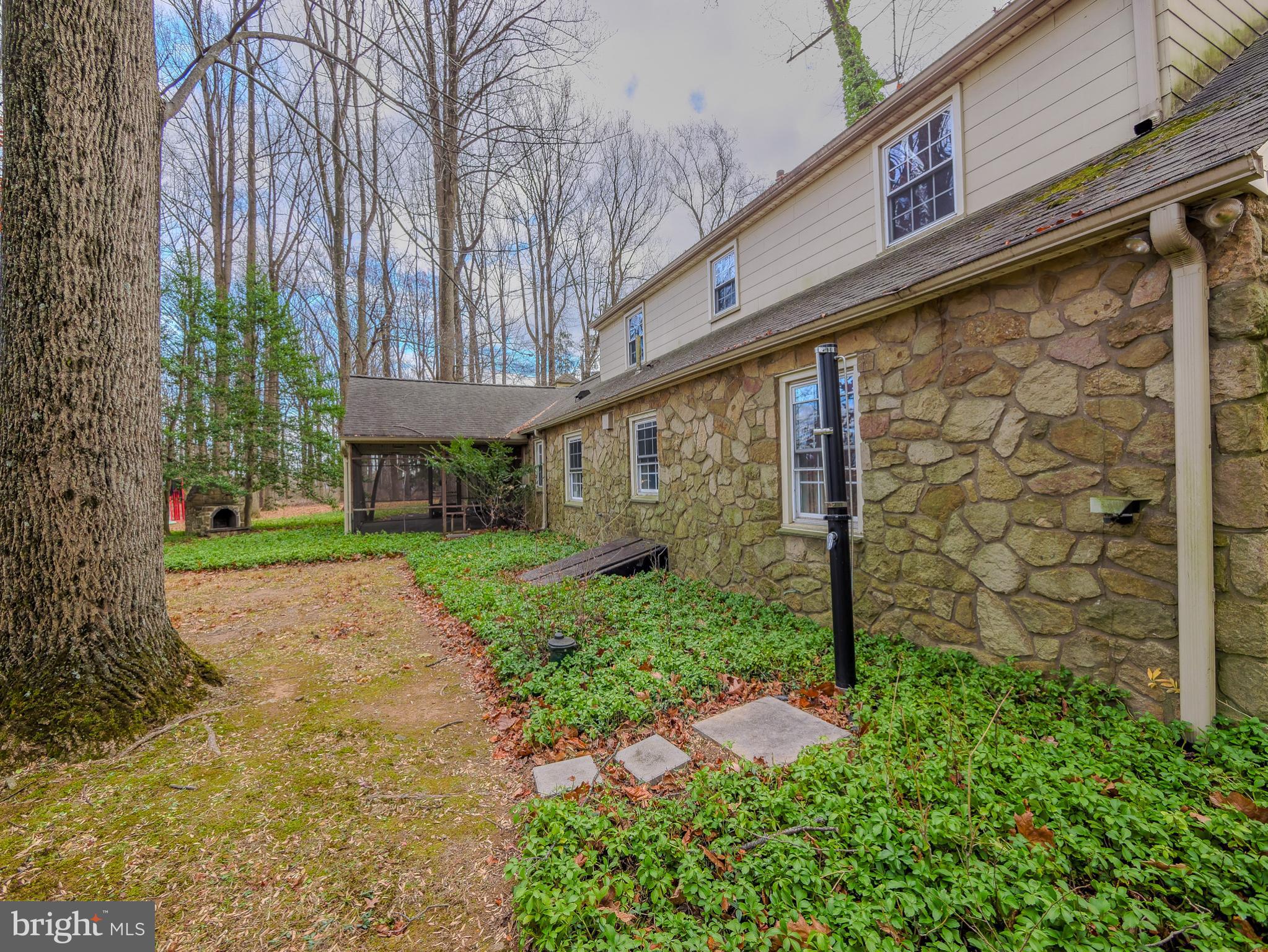 1985 Huntingdon Road Huntingdon Valley, PA 19006 - Photo 44 of 50 Stone exterior with view of porch.