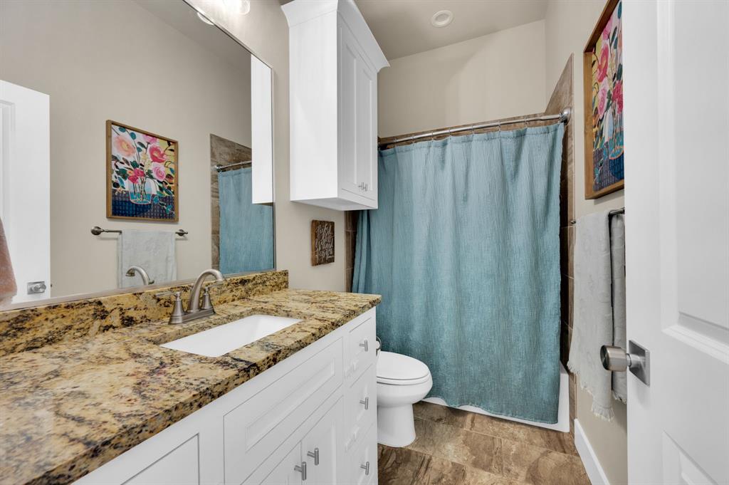 1313 Ridgeview Drive Weatherford, TX 76086 - Photo 18 of 34 Bathroom with vanity and shower / bath combo