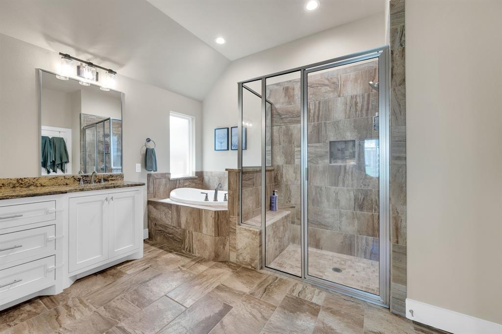 1313 Ridgeview Drive Weatherford, TX 76086 - Photo 22 of 34 Full bathroom featuring vanity, a shower stall, a garden tub, vaulted ceiling, and recessed lighting