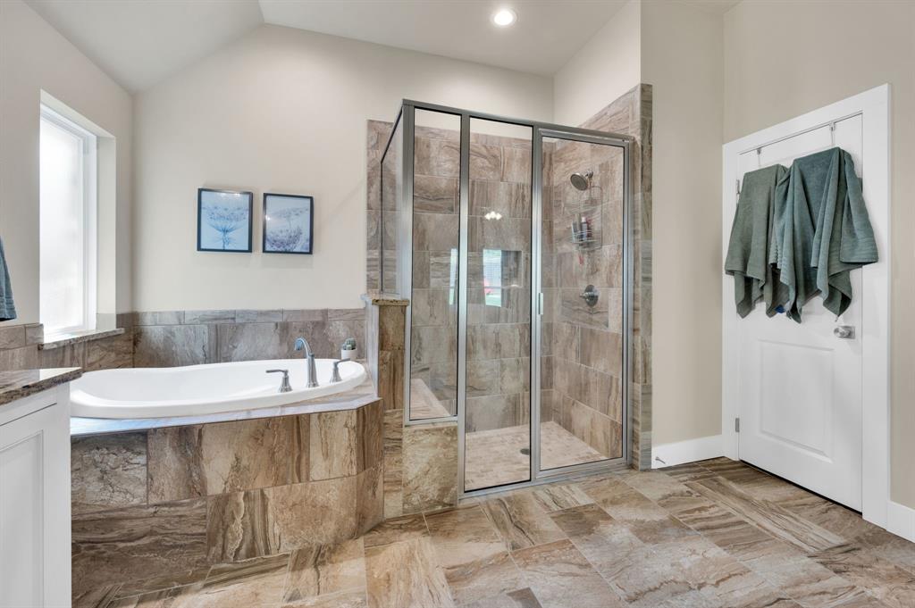1313 Ridgeview Drive Weatherford, TX 76086 - Photo 24 of 34 Full bathroom with a stall shower, a garden tub, vanity, recessed lighting, and lofted ceiling