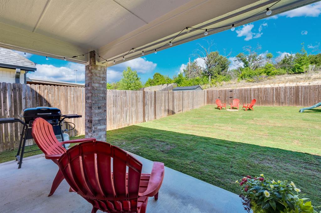 1313 Ridgeview Drive Weatherford, TX 76086 - Photo 30 of 34 Fenced backyard with a patio area