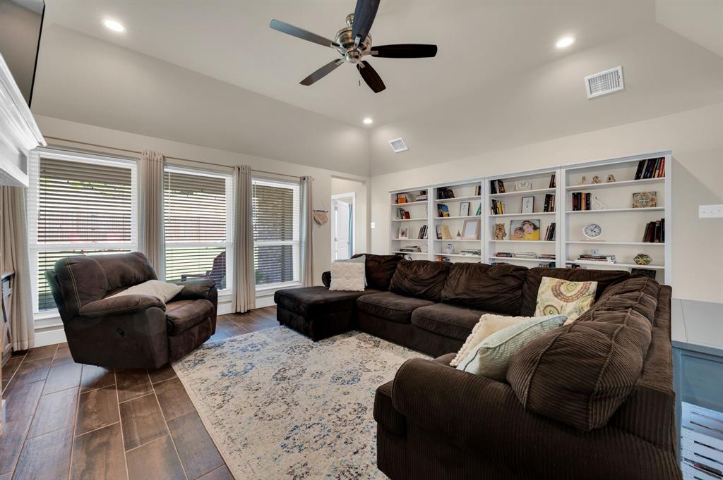 1313 Ridgeview Drive Weatherford, TX 76086 - Photo 4 of 34 Living area with vaulted ceiling, wood tiled floors, a ceiling fan, and recessed lighting