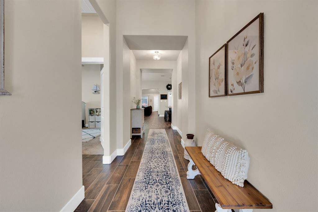 1313 Ridgeview Drive Weatherford, TX 76086 - Photo 6 of 34 Corridor with wood tiled floors and baseboards