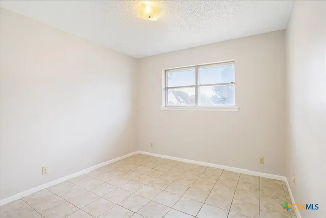 an empty room with a empty space and window