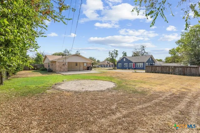 a view of a house with a big yard