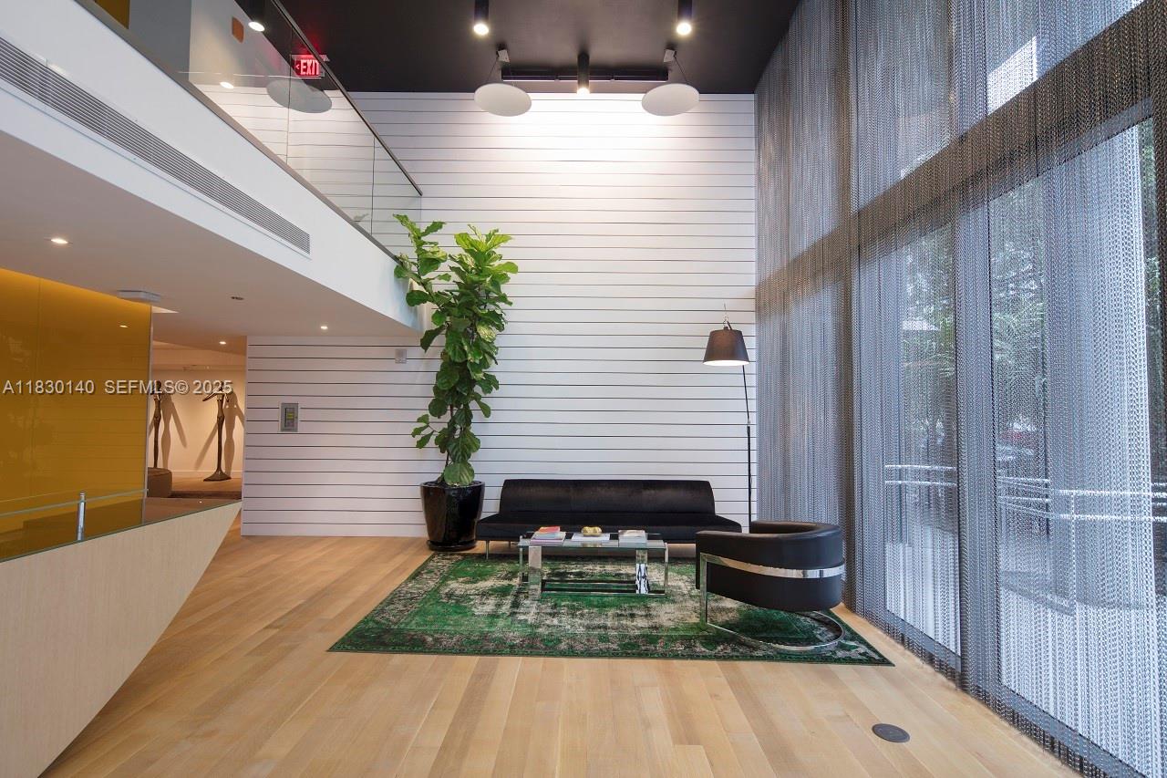 a view of house with backyard and sitting area