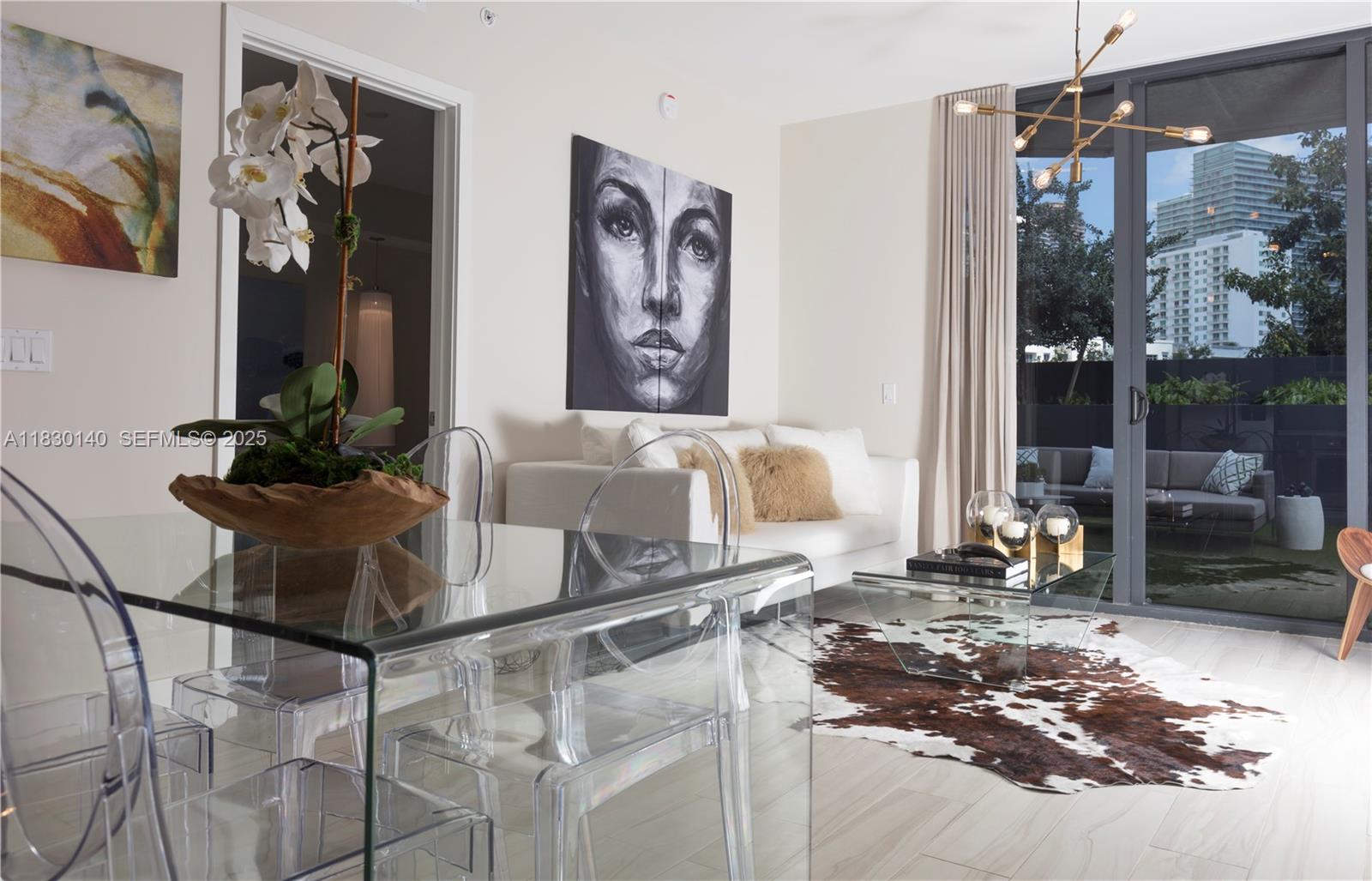 201 Southwest 17th Road, Unit 307 Miami, FL 33129 - Photo 12 of 26 a living room with granite countertop furniture and a painting on the wall