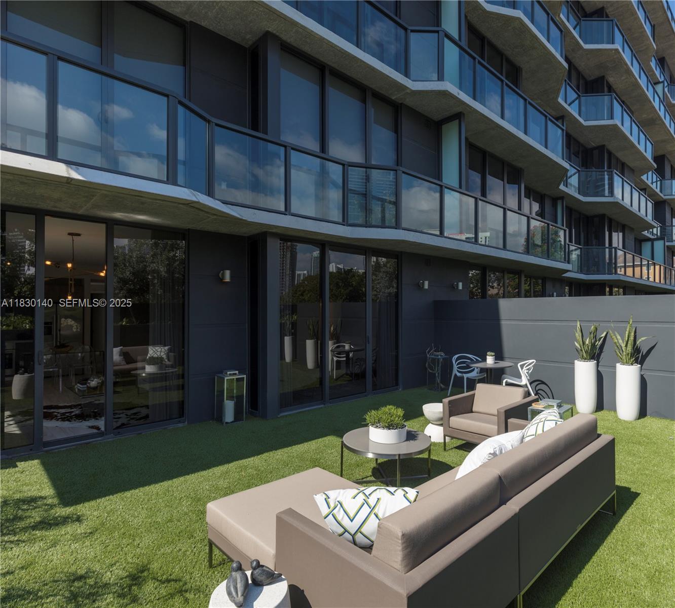 201 Southwest 17th Road, Unit 307 Miami, FL 33129 - Photo 13 of 26 a view of an apartment with a deck and a patio