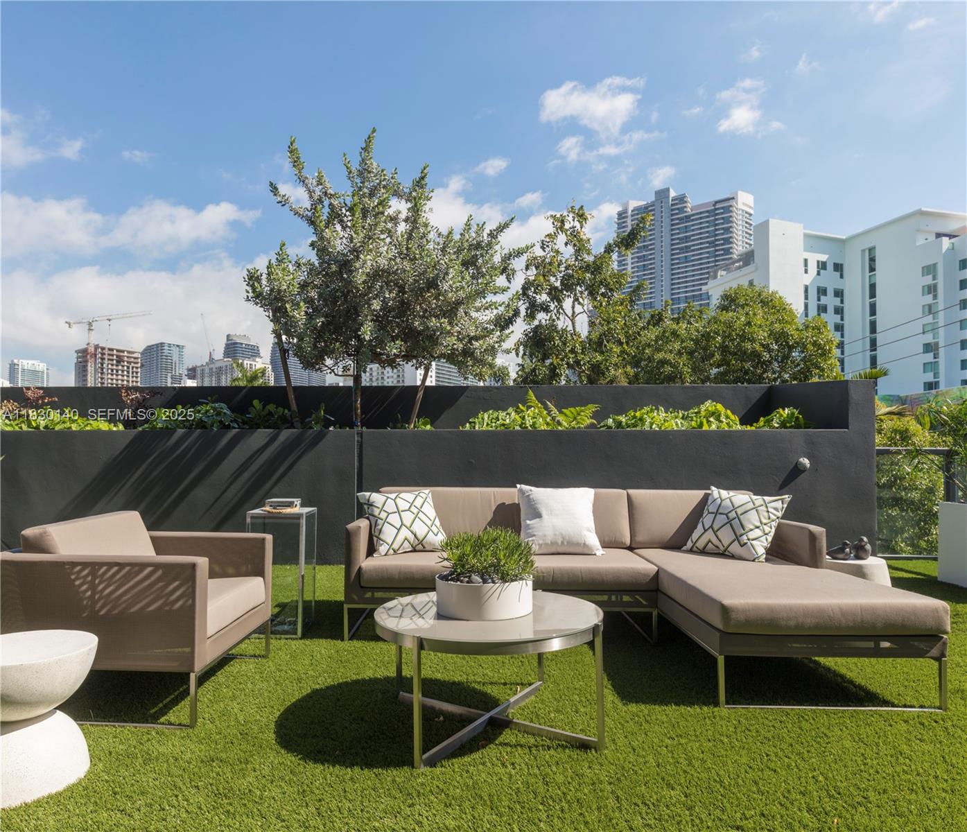 201 Southwest 17th Road, Unit 307 Miami, FL 33129 - Photo 14 of 26 a view of a patio with couches chairs and a potted plant