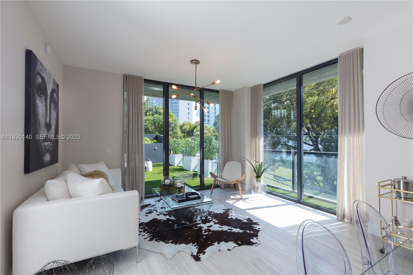 201 Southwest 17th Road, Unit 307 Miami, FL 33129 - Photo 16 of 26 a living room with furniture and a large window