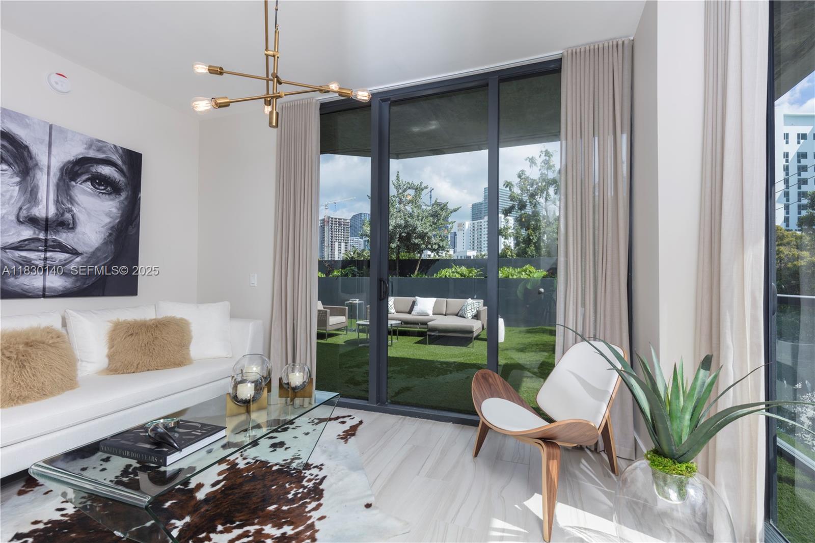 201 Southwest 17th Road, Unit 307 Miami, FL 33129 - Photo 17 of 26 a living room with furniture and a window