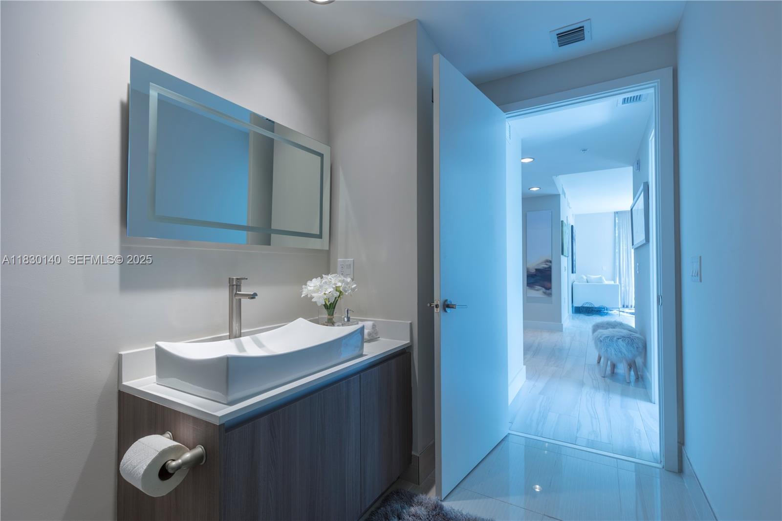 201 Southwest 17th Road, Unit 307 Miami, FL 33129 - Photo 19 of 26 a bathroom with a sink and a mirror