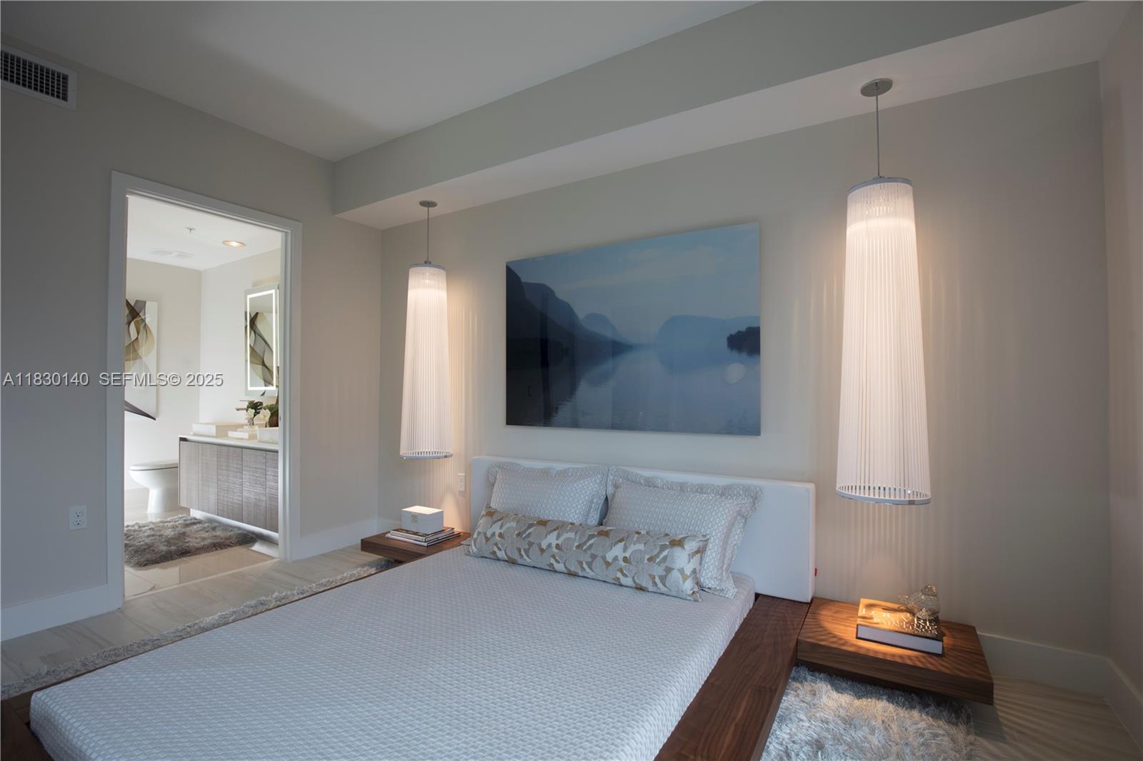 201 Southwest 17th Road, Unit 307 Miami, FL 33129 - Photo 21 of 26 a bedroom with a bed and a mirror