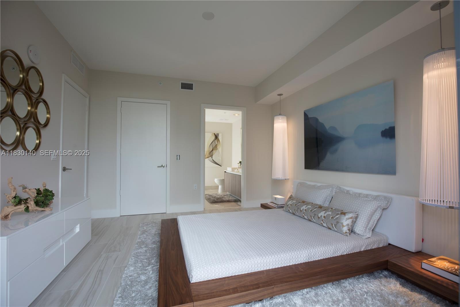 201 Southwest 17th Road, Unit 307 Miami, FL 33129 - Photo 22 of 26 a bedroom with a bed and a couch