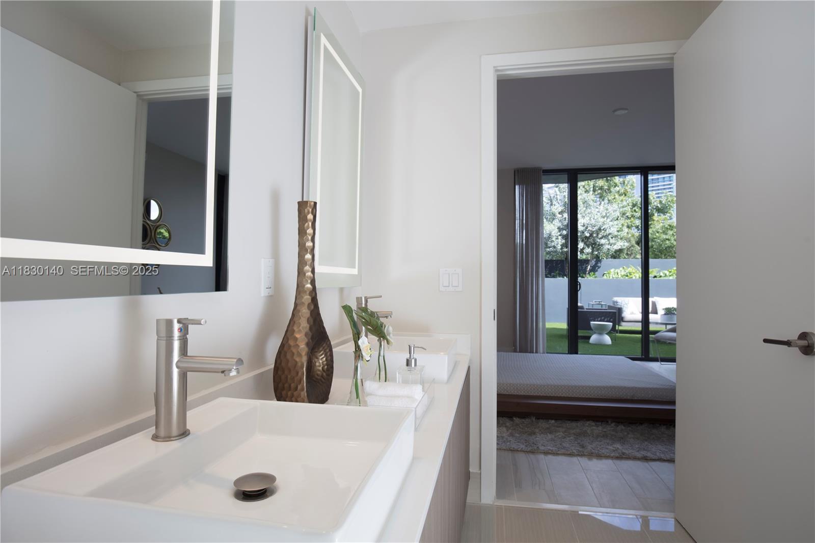 201 Southwest 17th Road, Unit 307 Miami, FL 33129 - Photo 25 of 26 a bathroom with a sink and a window