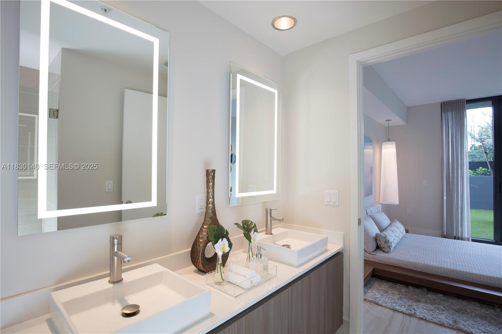 201 Southwest 17th Road, Unit 307 Miami, FL 33129 - Photo 26 of 26 a bathroom with a sink and a mirror