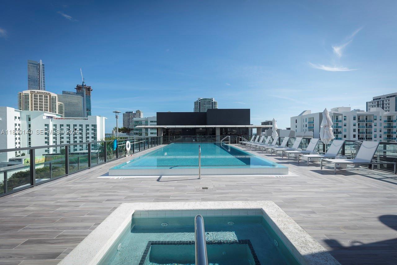 201 Southwest 17th Road, Unit 307 Miami, FL 33129 - Photo 4 of 26 a view of a terrace with wooden floor