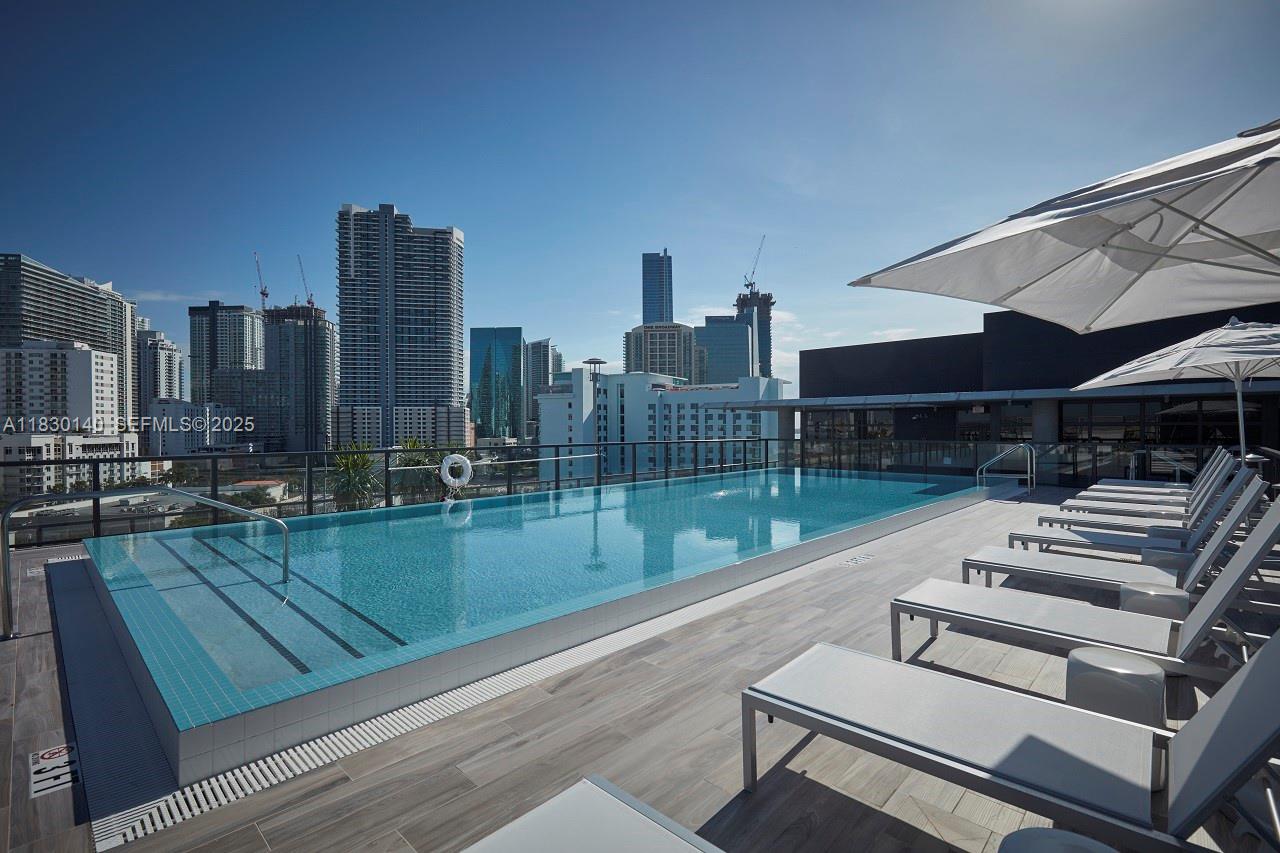 201 Southwest 17th Road, Unit 307 Miami, FL 33129 - Photo 5 of 26 a view of a patio with a yard