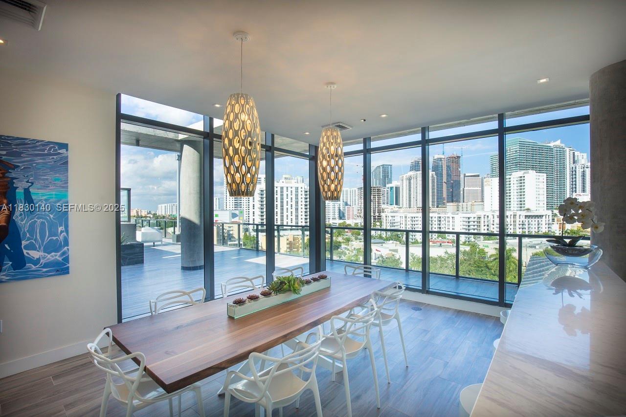 201 Southwest 17th Road, Unit 307 Miami, FL 33129 - Photo 6 of 26 a room with pool table and glass door