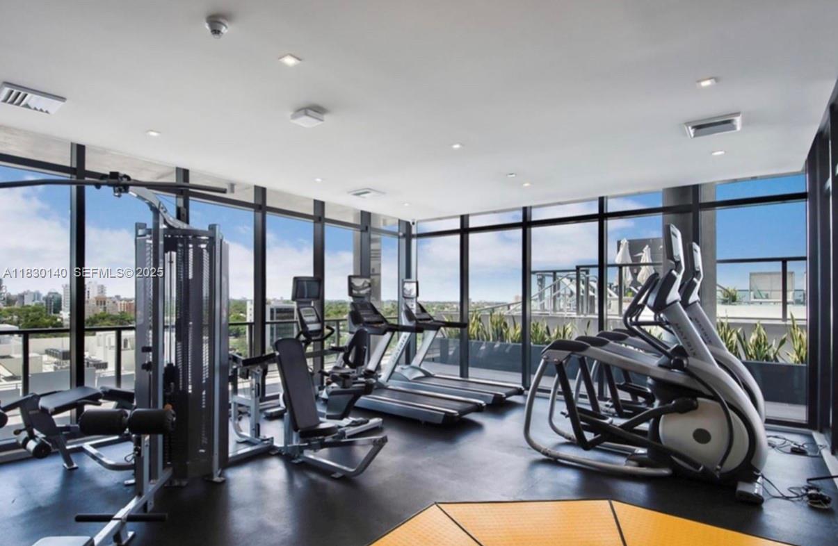 201 Southwest 17th Road, Unit 307 Miami, FL 33129 - Photo 8 of 26 a view of a room with gym equipment
