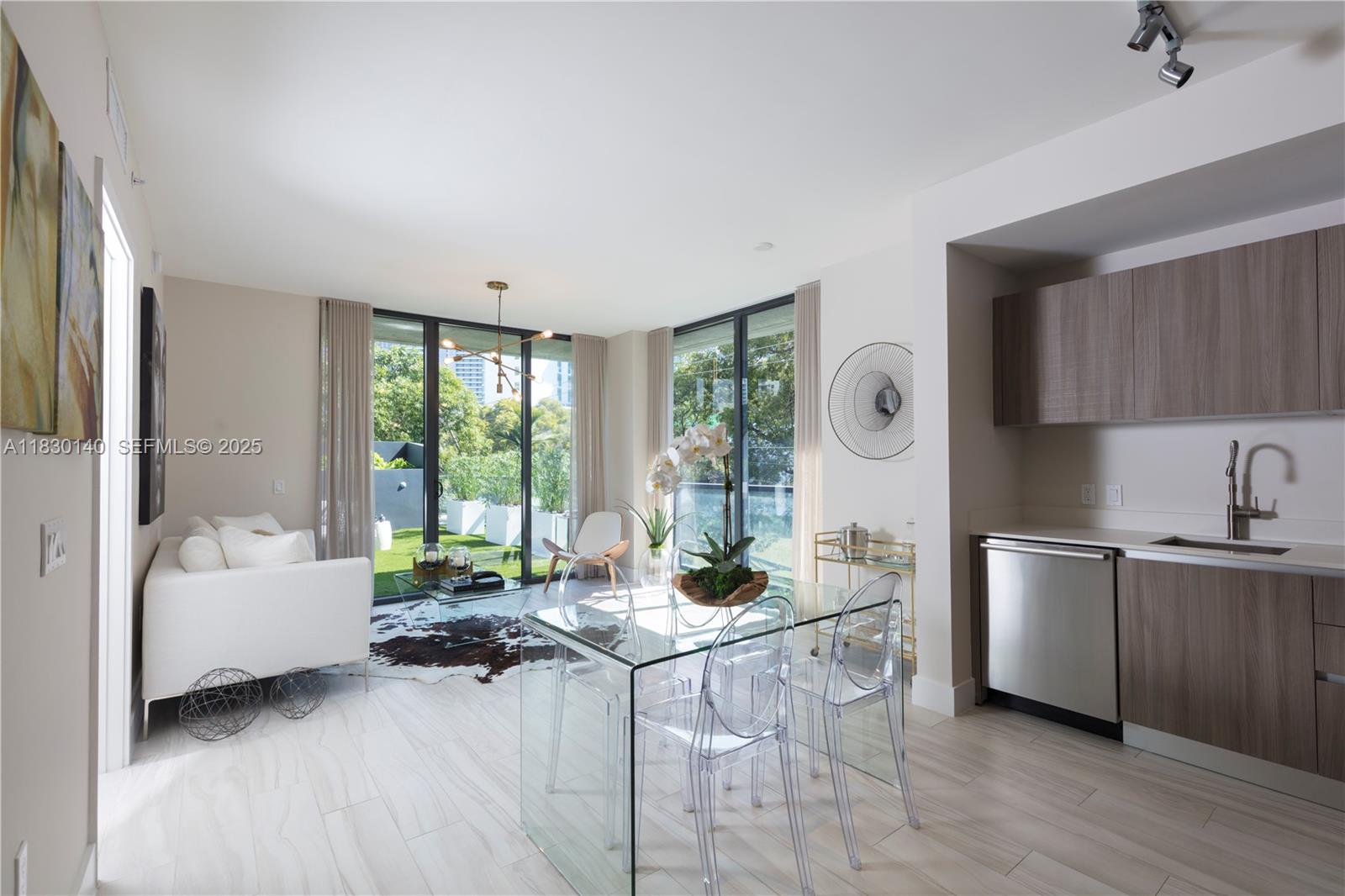 201 Southwest 17th Road, Unit 307 Miami, FL 33129 - Photo 9 of 26 a living room with furniture and a large window