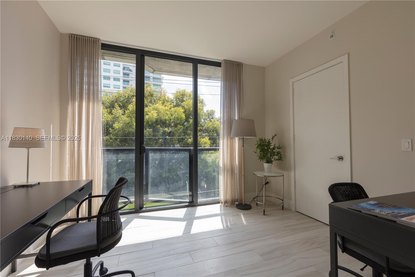 201 Southwest 17th Road, Unit 307 Miami, FL 33129 - Photo 10 of 26 a view of a workspace with furniture and a window