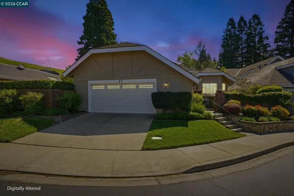 a front view of a house with yard